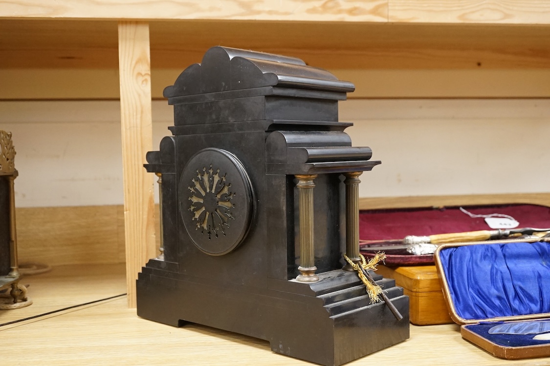 A black slate and gilt metal mounted mantel clock, 36cm high.
